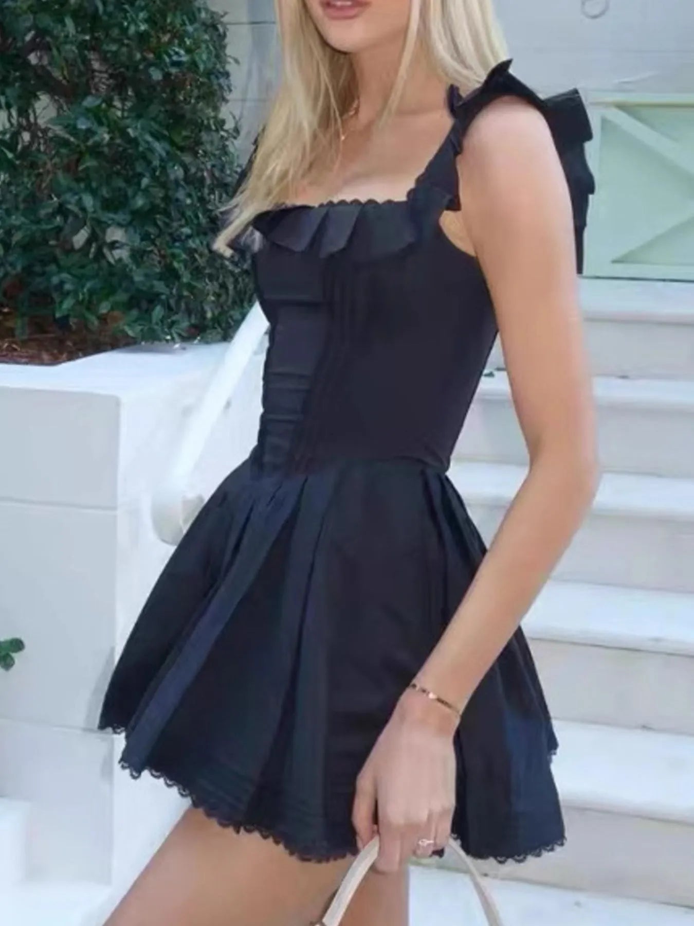 Square neck pleated mini dress with sleeveless design and structured pleats — stylish and flattering for day or evening wear