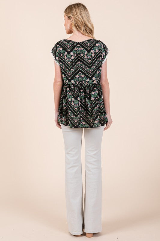 Effortlessly stylish — textured weave meets lace and pom-pom embellishments in this tunic.