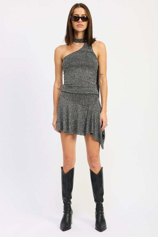 Scarf accent enhances elegance and styling versatility.