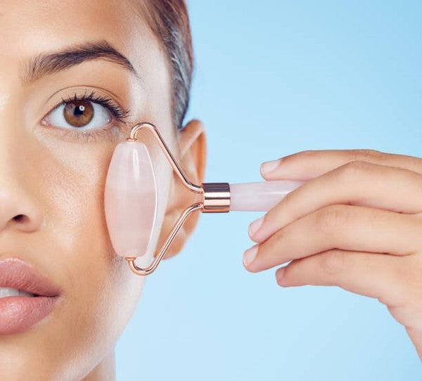 Rose Quartz Facial Roller with dual-ended design for facial massage and skincare enhancement