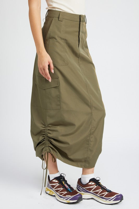Person wearing olive green cargo skirt