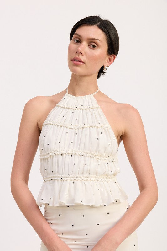 A statement top that pairs well with high-waist skirts or jeans.