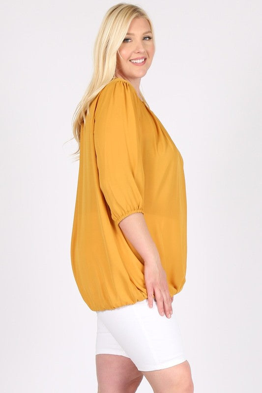 Solid color or subtle pattern, easy to pair with bottoms.
