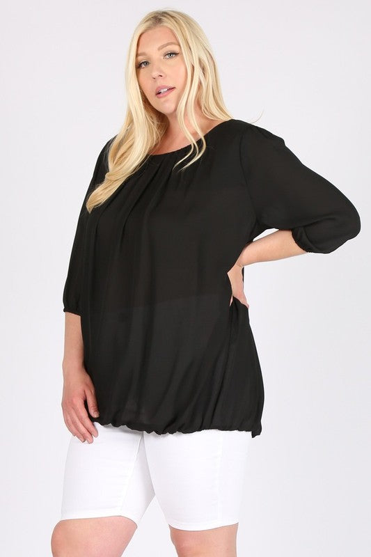 Ruffles bring a playful, flattering volume to the sleeve.
