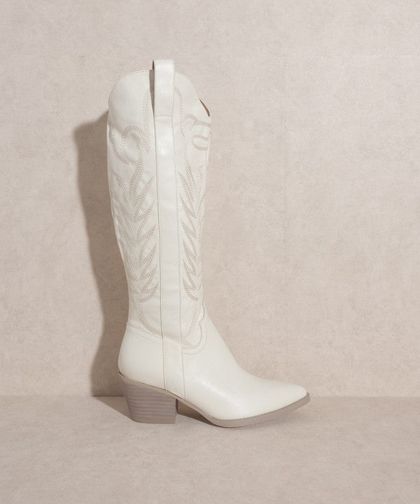 Knee-high western boots with embroidered stitching, pointed toe, stacked block heel, and side zipper closure.