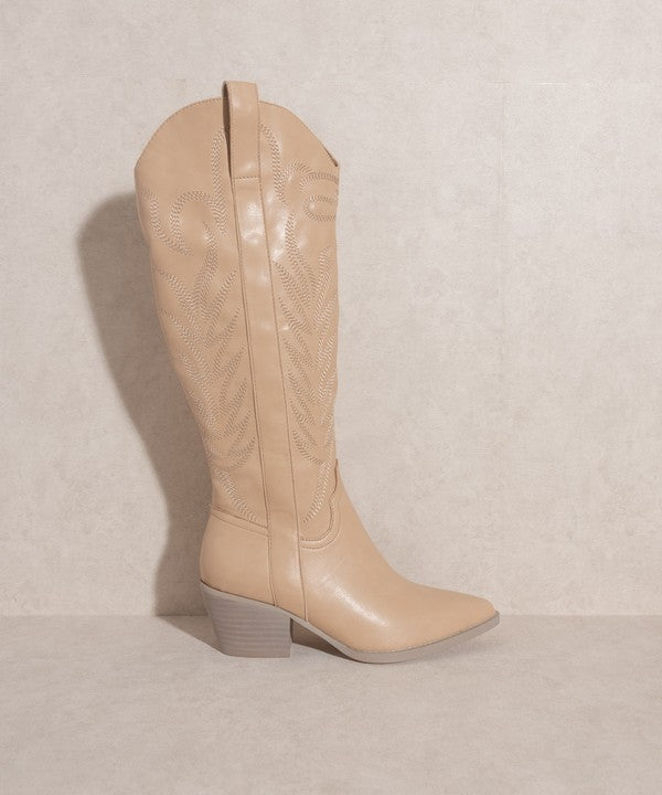 Knee-high western boots with embroidered stitching, pointed toe, stacked block heel, and side zipper closure.