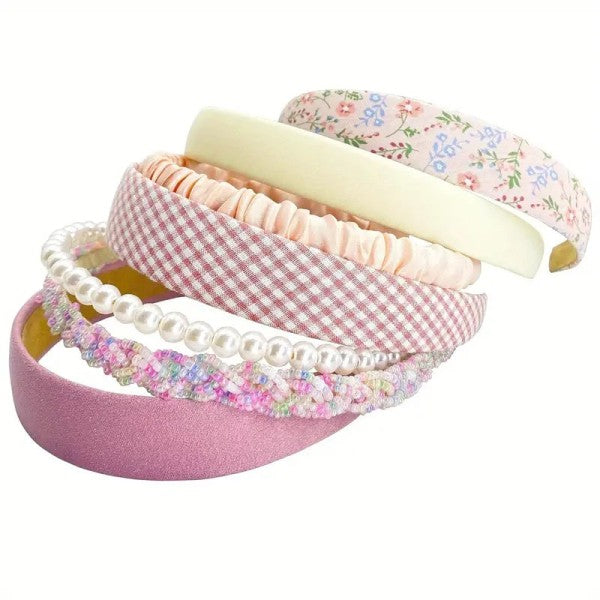 Set of seven pink headbands in assorted styles and textures — soft, stretchy, and perfect for everyday wear or accessorizing outfits