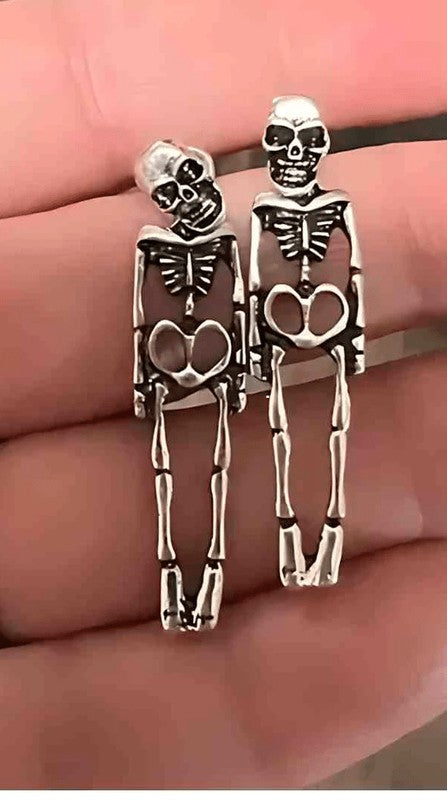 Playful. Edgy. Unforgettable. These Skeleton Stud Dangle Earrings are the perfect fusion of gothic flair and everyday wearability. With detailed skeleton bodies that swing from studded heads, they’re a bold accessory for Halloween, concerts, or just showing off your unique style.