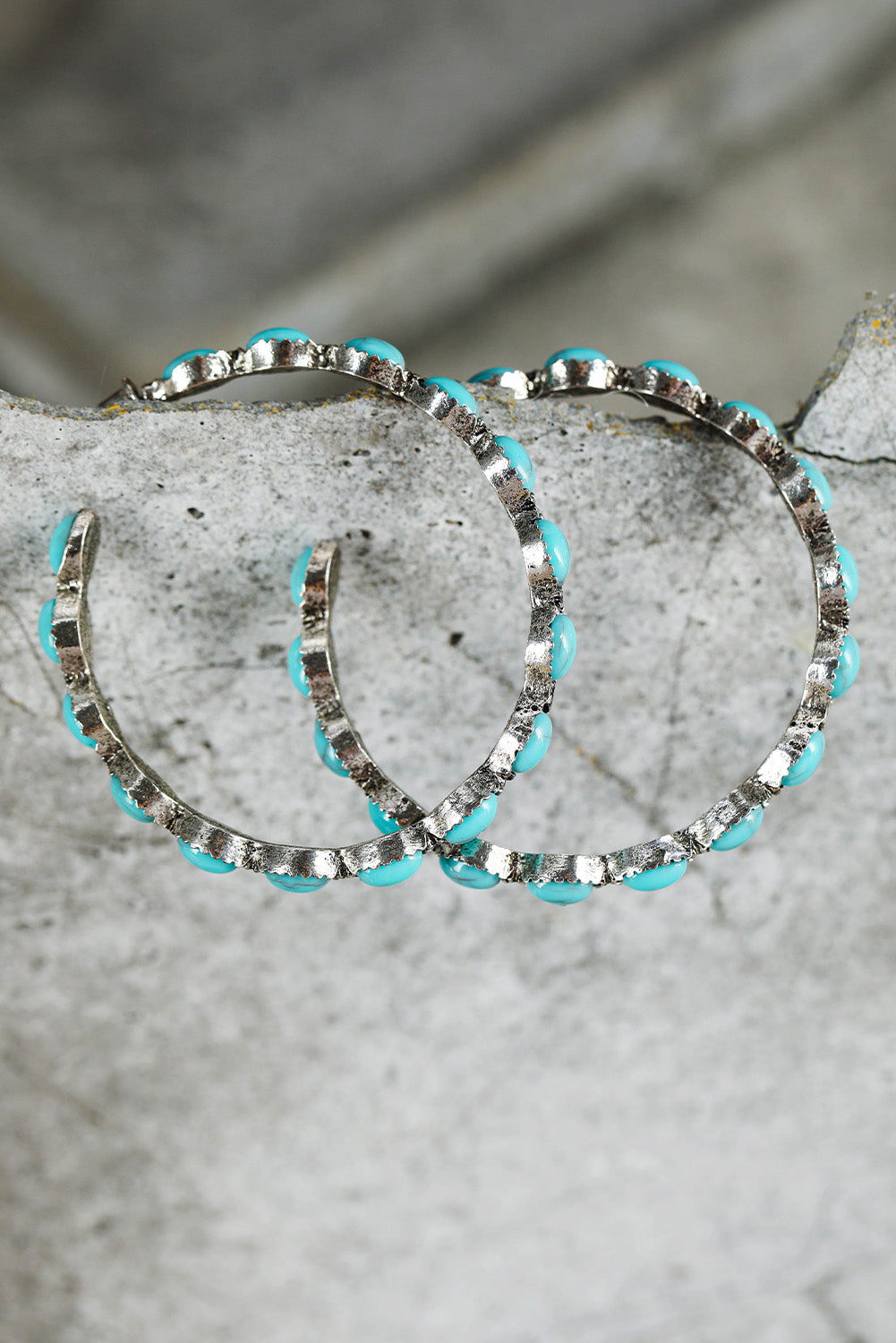 Vintage vibes, modern sparkle. These retro-inspired C-shape earrings are a dreamy blend of bold design and delicate detail. Featuring a smooth gold-tone curve inlaid with sky blue gems, they catch the light—and compliments—with every turn of your head.