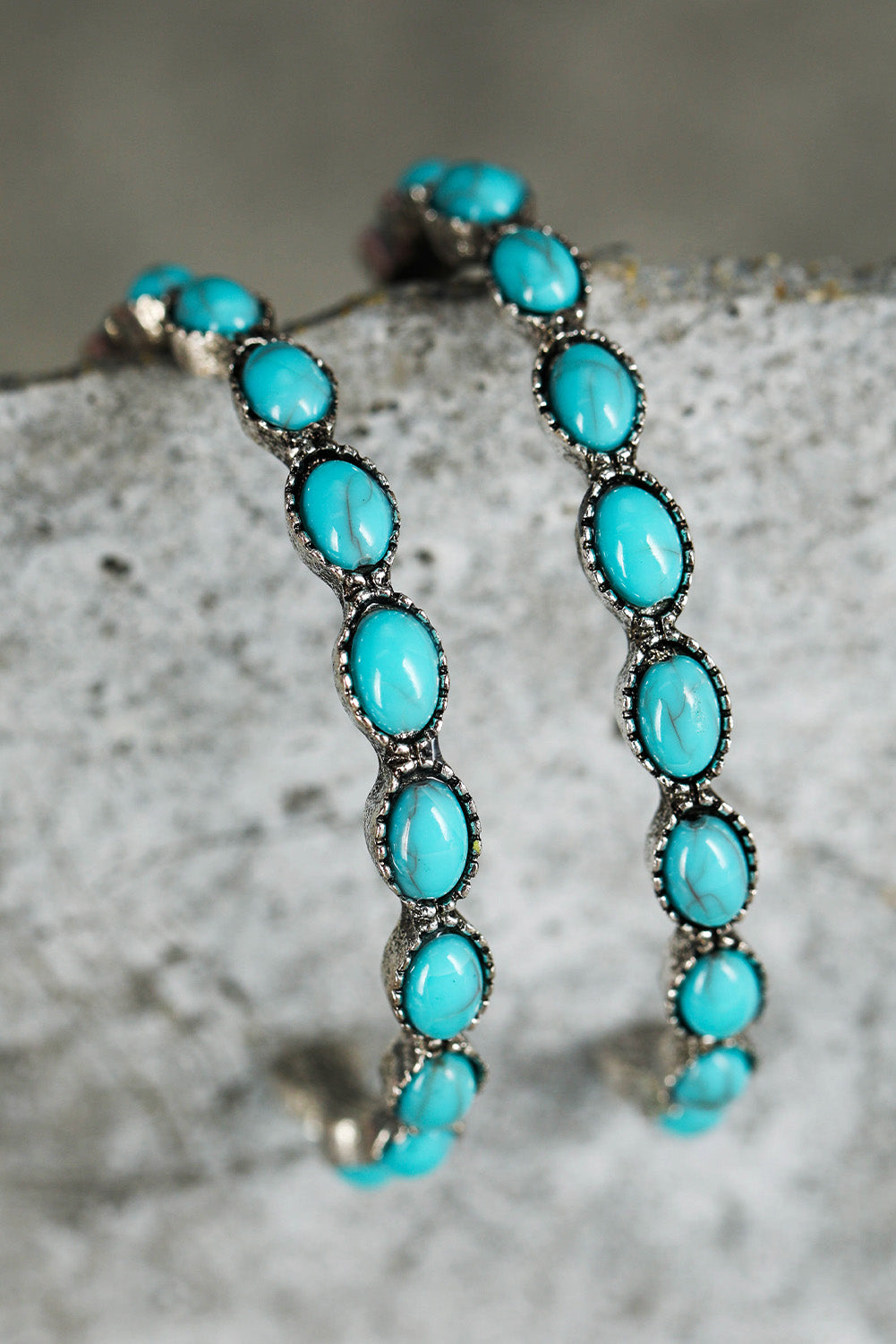 Vintage vibes, modern sparkle. These retro-inspired C-shape earrings are a dreamy blend of bold design and delicate detail. Featuring a smooth gold-tone curve inlaid with sky blue gems, they catch the light—and compliments—with every turn of your head.