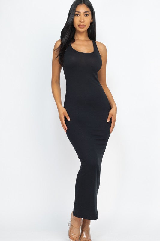 Woman wearing a black sleeveless dress on a white background