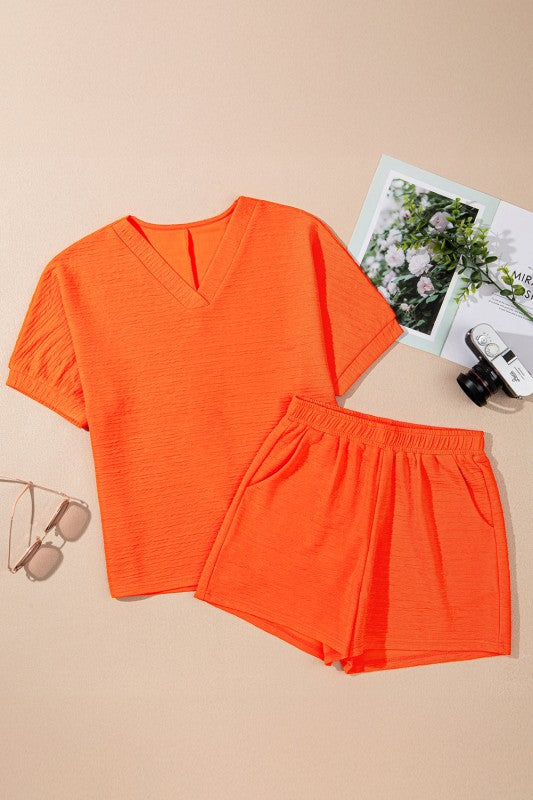Effortless style. Everyday comfort. This two-piece set combines a textured tee and matching shorts for a laid-back look that’s anything but basic. Whether you're lounging at home or heading out for errands, this set keeps you cool, coordinated, and confident.