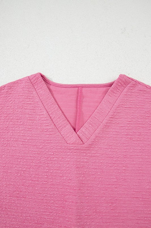 Effortless style. Everyday comfort. This two-piece set combines a textured tee and matching shorts for a laid-back look that’s anything but basic. Whether you're lounging at home or heading out for errands, this set keeps you cool, coordinated, and confident.