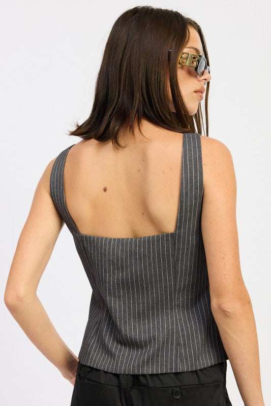 Grey pinstripe shade offers timeless versatility in styling.