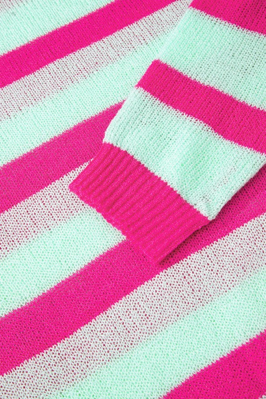 Model pairing a Stripe Round Neck Sweater with trousers.
