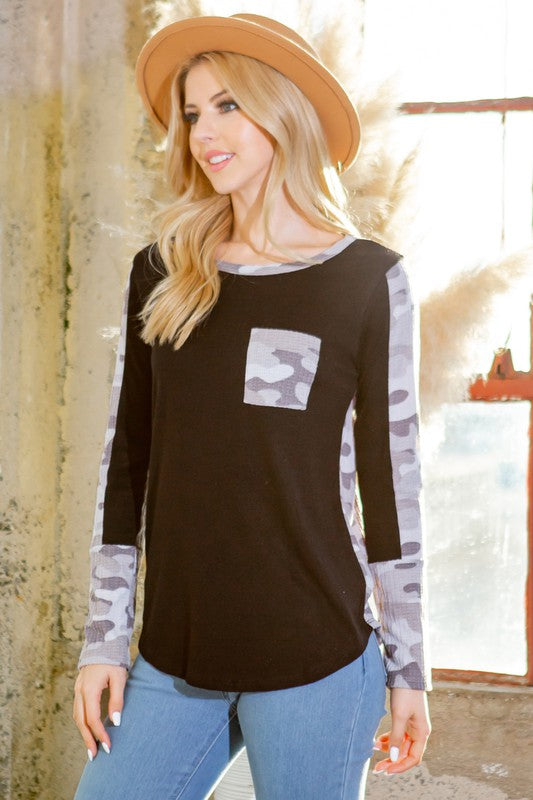 Knit sweater with camo print contrast — casual, stylish, comfortable.