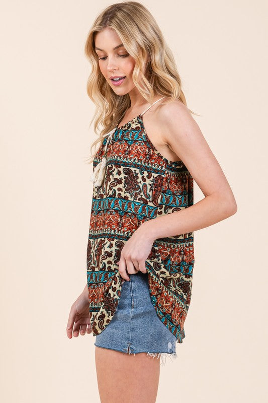 Soft woven material + a front tie detail make this top your new warm-weather go-to.