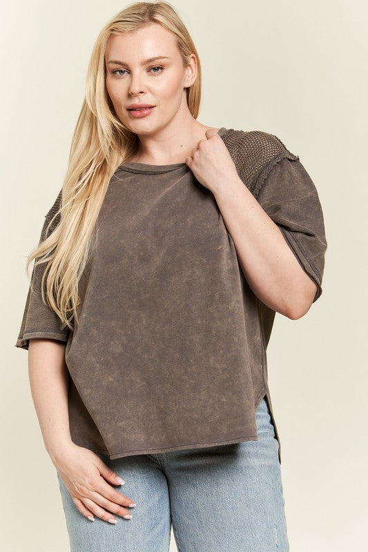 Short sleeves with unfinished hem for a raw, casual finish.