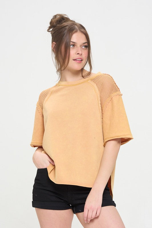 Raw edge sleeve hem gives a lived-in, edgy style.