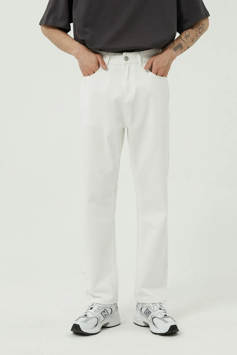 Classic silhouette. Modern edge. These jeans combine the timeless appeal of a straight leg with the sleekness of a slim fit—finished in a washed tone that adds character to every step.