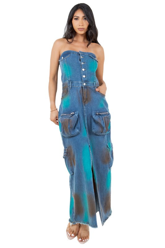 Model wearing a strapless, button-front denim maxi dress with a front slit.