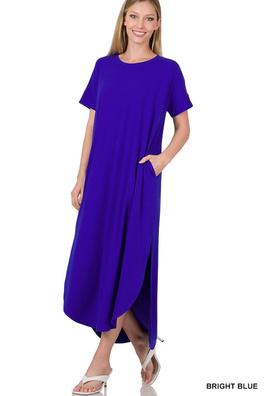 A bright coral-blue dress with short sleeves and a loose, draped silhouette that falls to about knee or mid-calf length.