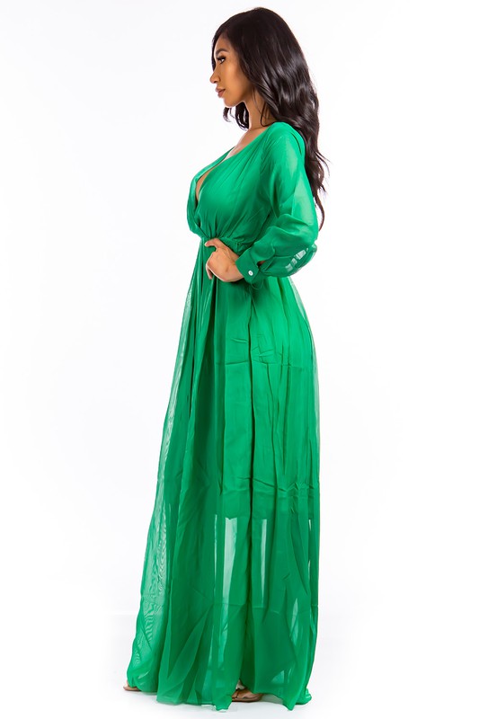 This sexy maxi dress features a form-fitting silhouette, a daring plunge neckline, and a flowing floor-length skirt that elongates the figure while adding a sultry, glamorous vibe.