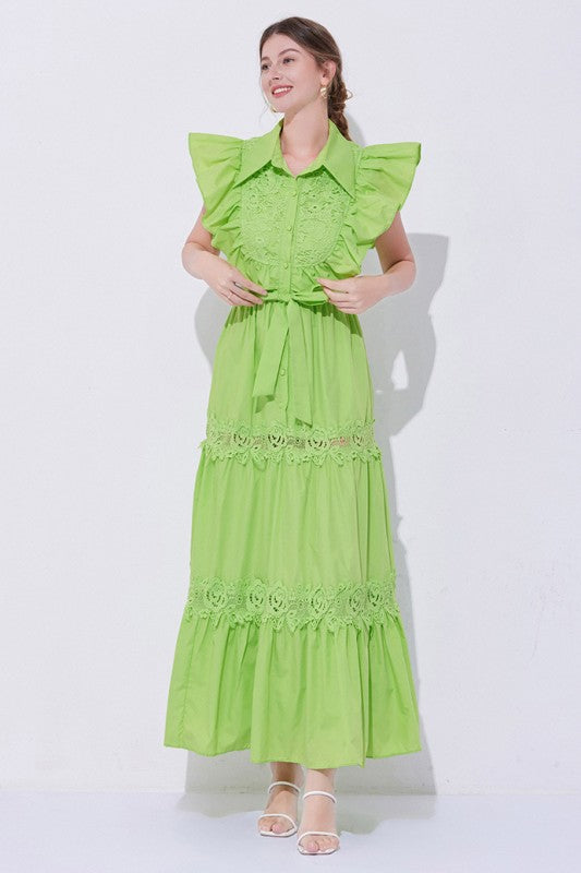 A green, midi-length piece with a tiered, ruffled silhouette and short puff sleeves, featuring delicate lace detailing for a romantic, bohemian look.