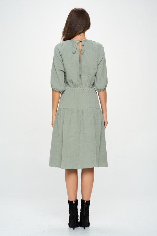Women's textured gauze tiered midi dress with elastic waist and 3/4 puff sleeves.