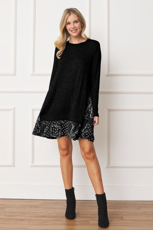 Women's long sleeve tunic top with bandana print layered hem and soft knit fabric.