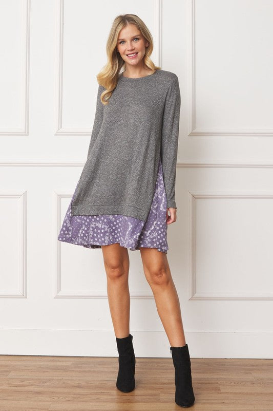 Women's long sleeve tunic top with bandana print layered hem and soft knit fabric.