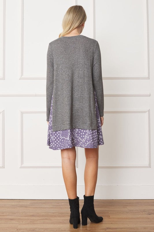 Women's long sleeve tunic top with bandana print layered hem and soft knit fabric.