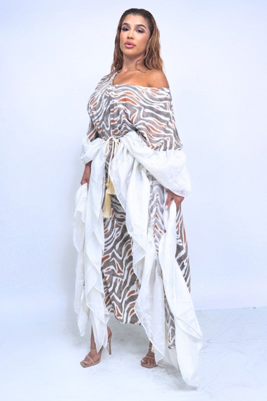 the Wild Dreams Flowing Maxi Dress is a breezy, ethereal gown featuring a fluid silhouette, soft drape, and dreamy, movement-friendly fabric that cascades to a graceful ankle-skimming hem.