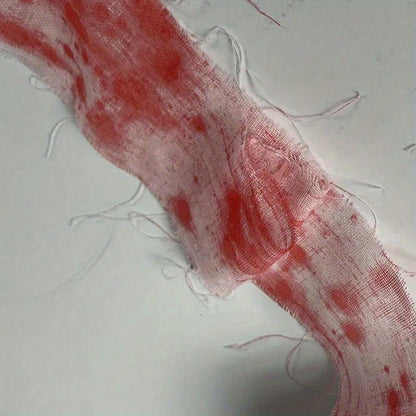 A roll of toilet paper designed to look like blood-stained gauze, likely for Halloween or horror-themed decor.