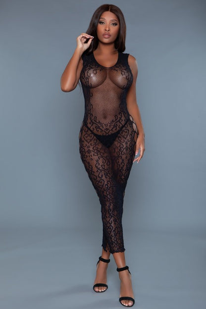 he dress is a sheer, full-length black lace outfit that hugs the body and reveals the undergarments beneath, with long sleeves and a graceful silhouette.
