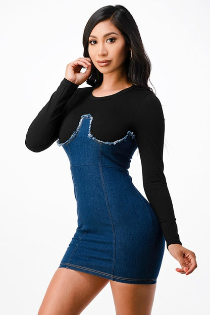 The dress is a form-fitting, color-block mini dress with a light gray long-sleeve top seamlessly blending into a dark blue denim-like bodice and skirt, creating a chic, body-skimming silhouette.
