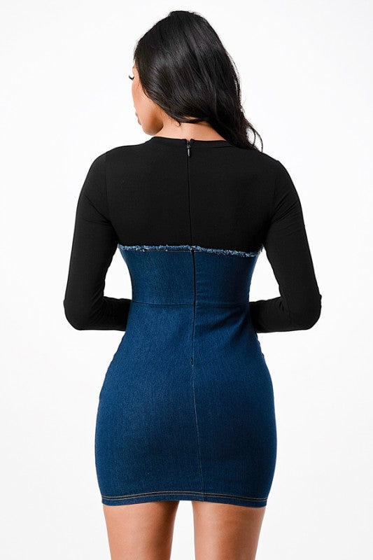 The dress is a form-fitting, color-block mini dress with a light gray long-sleeve top seamlessly blending into a dark blue denim-like bodice and skirt, creating a chic, body-skimming silhouette.