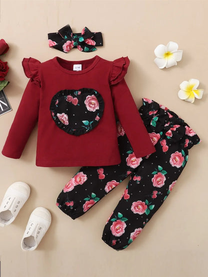 Baby girl outfit set in maroon with floral print top, coordinating bottoms, and headband

