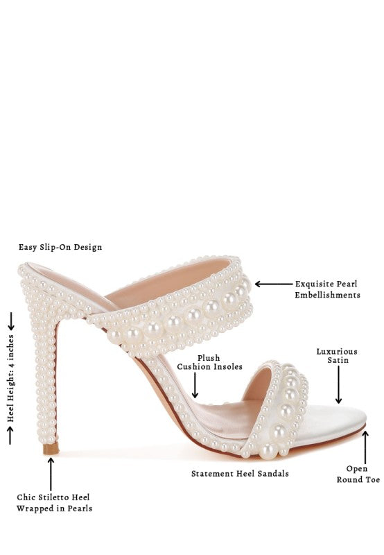 Pearl embellished high-heeled sandals with features highlighted on a white background