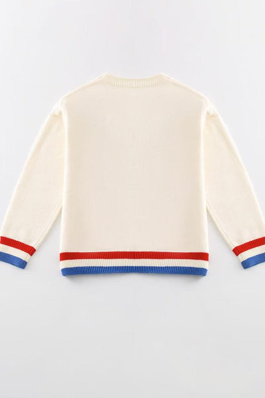 Beige sweater with red and blue stripes on a light gray background