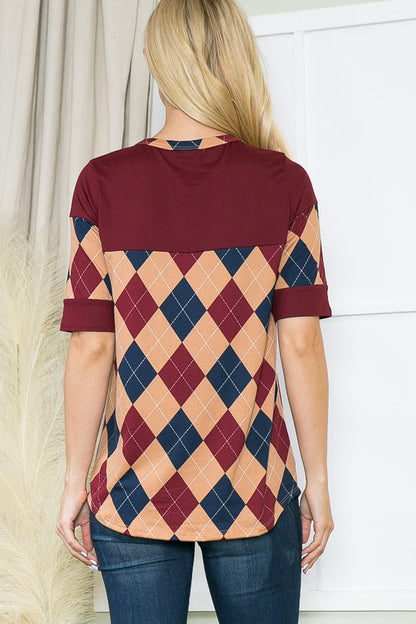 Buttoned front combines with geometric print for a modern twist on a classic.