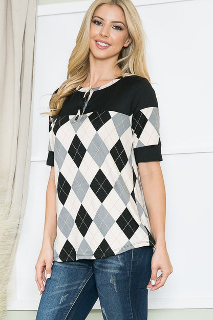 Clean lines, button front, and argyle pattern make this top ideal for layering.