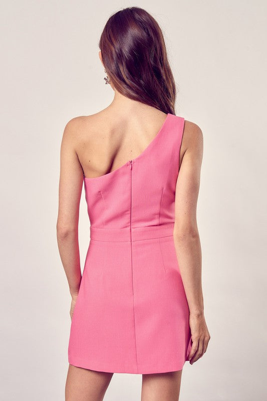 A one-shoulder, bright pink mini dress with a clean, simple silhouette that hugs the body and falls to mid-them.