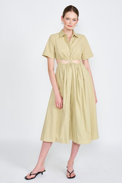 Woman models a stylish olive green midi dress with a collar, short sleeves, and fashionable cut-outs.