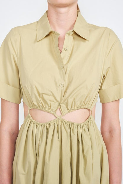 Woman models a stylish olive green midi dress with a collar, short sleeves, and fashionable cut-outs close up.