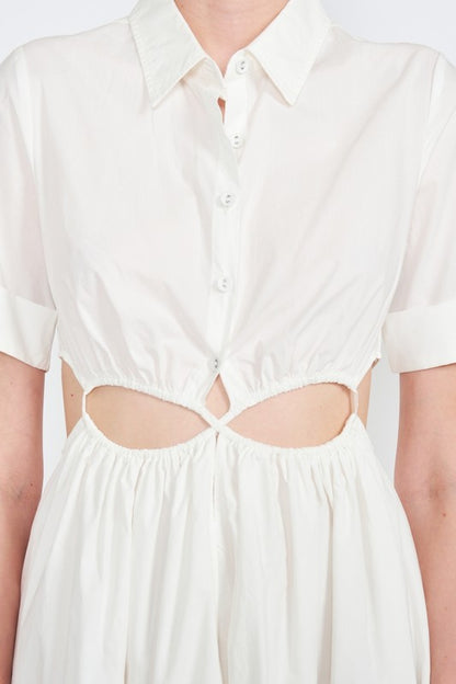 Woman models a white midi dress with a collar, short sleeves, and trendy cut-out details, close up view.