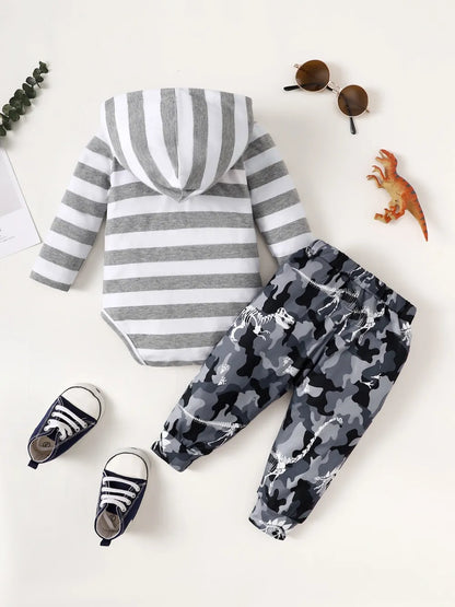 Children's outfit with striped hoodie and camouflage pants on a white background