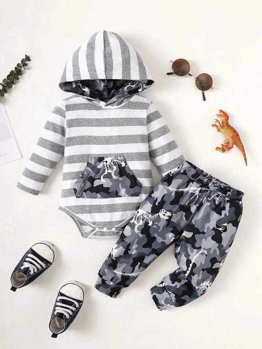 Children's outfit with striped hoodie and camouflage pants on a white background