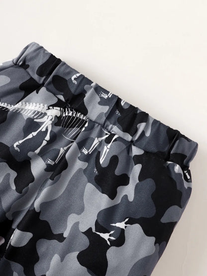 Camouflage-patterned shorts with a skeleton design on a white background