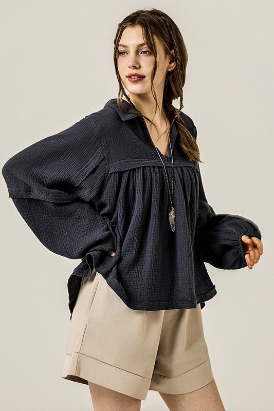 Balloon sleeves balance the loose torso silhouette stylishly. 